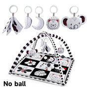 Baby activity mat with hanging toys on a white background