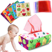 Colorful tissue box cover with cartoon fruits and vegetables, baby playing with it.