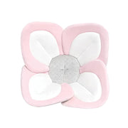 Floral-shaped cushion with pink, white, and gray petals on a white background