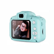 Children's digital camera with a screen displaying a photo on a white background
