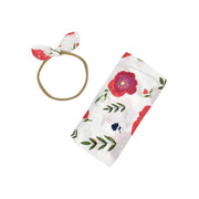 El conjunto de envoltura y diadema para bebé tiene lindos colores