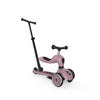 Pink scooter with a black handlebar on a white background