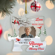 Personalized Christmas ornament with a photo of an elderly woman, red birds, and text on a blurred Christmas tree background.