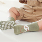 Calcetines antideslizantes con dibujos animados lindos para niñas y niños